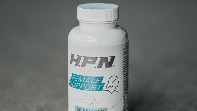 Eine Dose H.P.N Female Support steht auf einer Betonfläche.